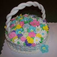 Easter Basket A basket cake I made for my family easter. Fondant handle and royal icing flowers.