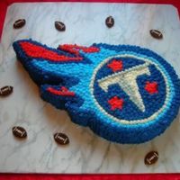 Tennessee Titans Groom's Cake This was my first sculpted cake. My DH did the initial pattern for me and I did the rest. Plain white cake and BC frosting. Suggestions,...