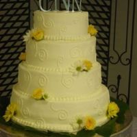 Scrolled Daisies This one was fun. It was certainly an exercise in learning the properway to dowel and support a 4 tier!! BC with fresh flower accents