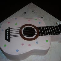 Pink Guitar Cake Thanks to PB for help/inspiration for this one. Sculpted white cake with BC frosting, chocolate "strings", fondant flowers and...