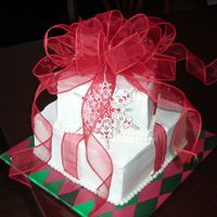 Christmas Present Cake This was SOO fun to make. Square cake kind of scared me though. But not anymore :-) Devil's food cake, BC frosting, fabric bow and...