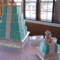 Tiffany Box Wedding Cake 14" Red Velvet, coconut filling, 12" White, bavarian cream filling, 10" Strawberry, strawberry filling, 8" Lemon, lemon...