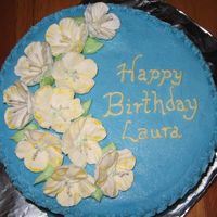 Petunia Birthday Cake An 8" cake made for a good friend. Her favorite colors are blue and yellow. Buttercream with my first attempts at royal icing petunias...