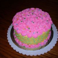 Pink And Yellow Rosette Cake This is a vanilla cake with buttercream frosting and filling. It was lots of fun to make. This was my 2nd cake. I torted it into 4 layers....