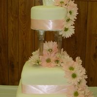 Cynthias Wedding fondant covered, bottom layer chocolate, other 2 are butter. fresh daisies