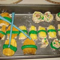 Sushi Rice Krispie treats and fondant- not nearly as good as the ones that inspired it. Chopsticks are fondant, and the orange "fish"...