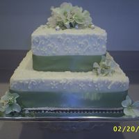 Ivory & Willow Green This is my first wedding cake (besides Wilton Course III). It was made for a good friend of my fiance's. Unfortinately, the wedding...