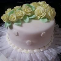 Yellow Rose This was a fondant flower spray on the top tier of a wedding cake for my cake class.