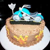 Drew's Motorcycle Cake This was a marble cake with chocolate buttercream. The "flames" are chocolate and the motorcycle gumpaste.