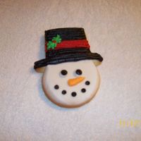 Snowman Sugar cookies decorated with Wilton's snow-white buttercream.