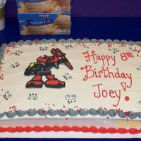 Bionicles Basic marble cake with BC frosting and BCT bionicle robot.