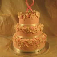 Breast Cancer Foundation Cake Fondant covered cakes, gumpaste flowers, gumpaste breast cancer ribbon, real ribbon around cakes