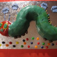 The Very Hungry Caterpillar I made this cake for my daughter's first birthday, it is her favorite book! It is a bundt cake cut into the shape of the caterpillar...