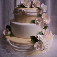 Wedding Rose Cascade Wedding cake for my sister's wedding. Roses made in gumpaste and cake covered in Fondant.