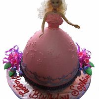 Doll Cake Doll cake iced with buttercream, gumpaste flowers and satin ribbons.