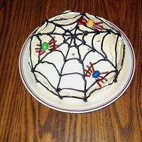 Spider Cake Another of my first attempt at a decorated cake. Simple spiderweb design with spiders made out of peanut M&M's & licorice...