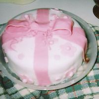 Birthday Present Cake This was a project from a wilton class. I'm not proudest of this one, but I want more pictures on my page, lol it's a fondant...