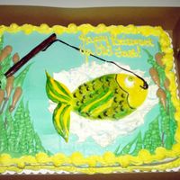 Gone Fishing Half sheet cake with buttercream icing and fondant work for the fish and fishing pole. I painted the fondant with color paste.