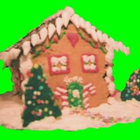 Gingerbread House Cake This one's a "gingerbread" flavored cake. It's stacked and carved to the shape of a house, then iced in light brown...