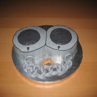 Handcuffs Buttercream with fondant link chain and keys.