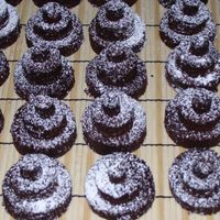Three Tier Brownies Mocha Fudge Brownies presented in tiers, dusted with powdered sugar