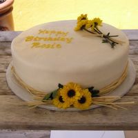 Sunflowers I finally got a chance to use LorAnn's Princess cake flavoring on this 12" round. Yummy! Buttercream filling with fresh sliced...