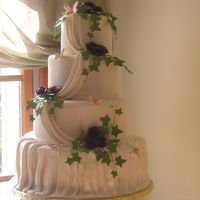 Fondant Draped Skirt It took a while to figure out how to do that bottom skirt, but I finally got it! Roses and ivy are gumpaste. The cake is a dummy, just for...