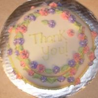 My First Cake Ever! This was a thank you cake for my boyfriends parents. It was lemon cake covered with fondant and royal icing flowers.