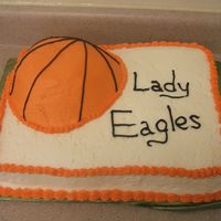 Basketball Lady Eagles Spice cake w/ cream cheese icing. I couldn't find my sports ball pan so I carved the basketball out of a 9" round. Last minute...
