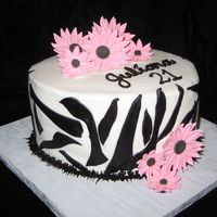 Zebra With Gumpaste Daisies Buttercream with fondant stripes, gumpaste daisies