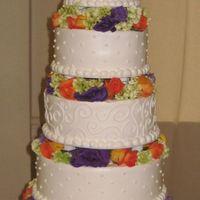 Img_0559.jpg 6,8,10,12,14 round cakes with fresh flowers in between. All buttercream.