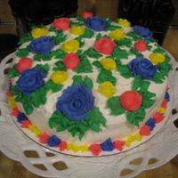 Multi Color Flower Cake One of my first cakes. Just went crazy expermenting with colors and flowers