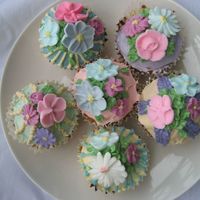 Cup Cakes - Spring Garden It's cup cakes topped with royal icing flowers and buttercream. I love to give it a name cause the cupcakes really looks like a garden...