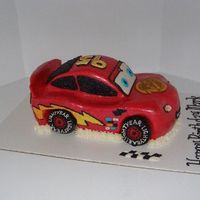 Lightning Mcqueen (Side View) Inspired by many cakes on here! This is yellow cake with a thick layer of vanilla BC under the MMF. I hand piped all of the decorations...