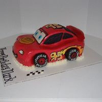 Lightning Mcqueen (Side View) Inspired by many cakes on here! This is yellow cake with a thick layer of vanilla BC under the MMF. I hand piped all of the decorations...
