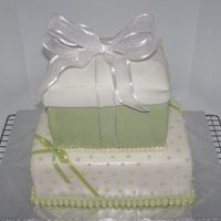Green Present Cake Did this for a friend's bridal shower. White cake with strawberry filling covered with vanilla buttercream and fondant.