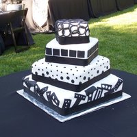 Art Deco This cake was originally done in buttercream with buttercream designs in black. The cake was delivered and I was called to re-do the entire...
