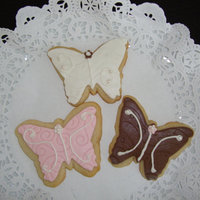 Baby Shower Butterflies Butterfly-shaped sugar cookies w/fondant (Satin Ice, embossed) and RI w/fondant (SI) pearls. Made 2 dozen for a co-worker.