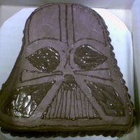 Darth Vader I couldn't order the Darth Vader character pan in time, so I just carved this out of an 11x15 sheet cake. It's chocolate cake...