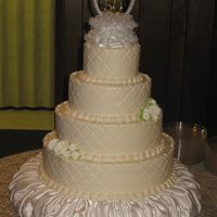 Ivory Anniversary This is a cake I did for my in-law's 50th Anniversary. It is covered in buttercream with royal icing roses.