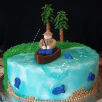 Fishing Cake Made for my dad who loves to fish. Entirely edible except for the fishing pole.