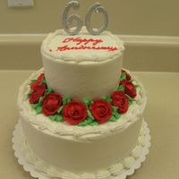 60Th Anniversary This is a two-tiered anniversary cake done in buttercream. The numbers on the top are made out of meringue and then airbrushed with silver...