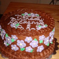 Chocolate & Purple Flowers Made this for a little girls 5th birthday. All she wanted was a white cake with chocolate frosting and purple flowers. She also wanted to...