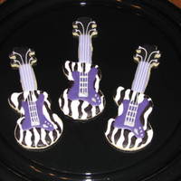 Hanna Montana Guitar Cookies NFSC w/ Carmie00 icing, royal details, This customer did a Hanna Montana birthday party and requested a guitar specifically with purple...