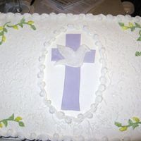 Confirmation_003.jpg Gumpaste cross and Dove. Brushed with super pearl. Made this for a friends confirmation.