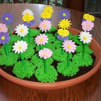 Flower Cupcakes I used the Famous Chocolate Wafer Cookies to make "dirt" to plant my cupcakes in the terra cotta tray (a drip tray from a planter...