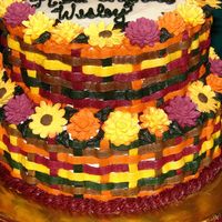 Multicolor Basketweave These are royal icing flowers with half butter half shortening BC icing for the basketweave.