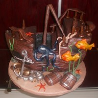 Suken Treasure Ship Chocolate Kahlua cake filled with dark chocolate truffle. Iced in buttercream and covered with fondant. All ship detailing, sea creatures...