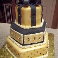 50Th Birthday Cake Made this for a co-worker's husband's 50th birthday. Chocolate fudge cake, with white chocolate buttercream and MMF. Used a new...