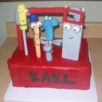 Handy Manny Toolbox Fondant covered cake and fondant characters. I had some trouble with it and it didn't turn out like I had hoped, but the client was...